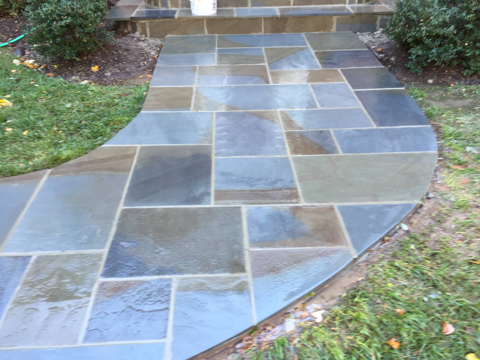 Curved bluestone walkway across a lawn in Northern Virginia