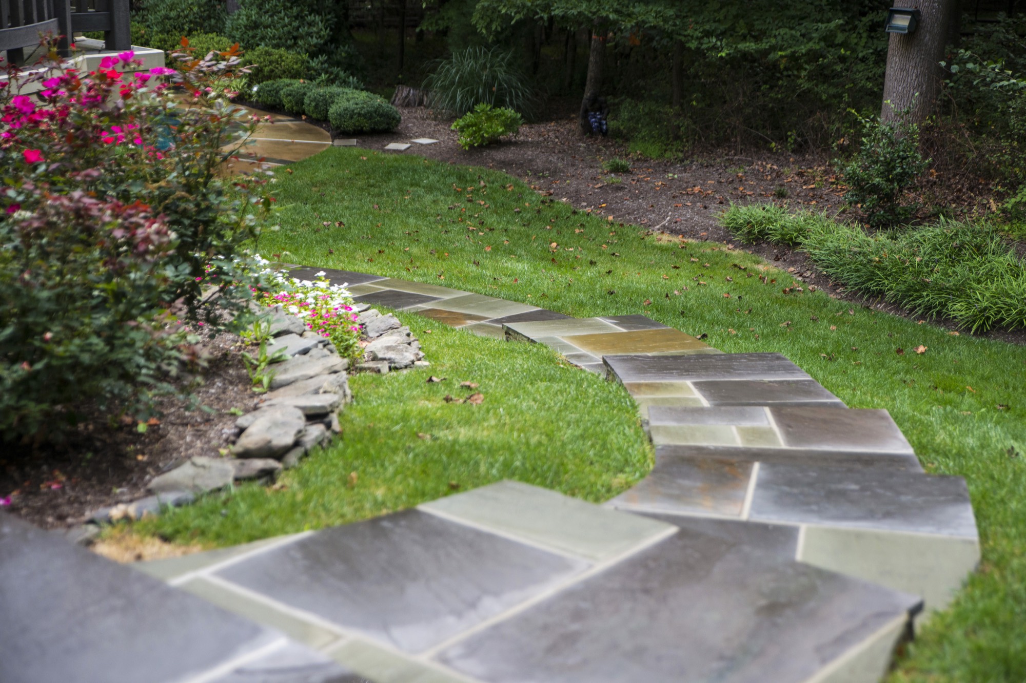 Flagstone garden path with stone border and flower beds in Northern Virginia